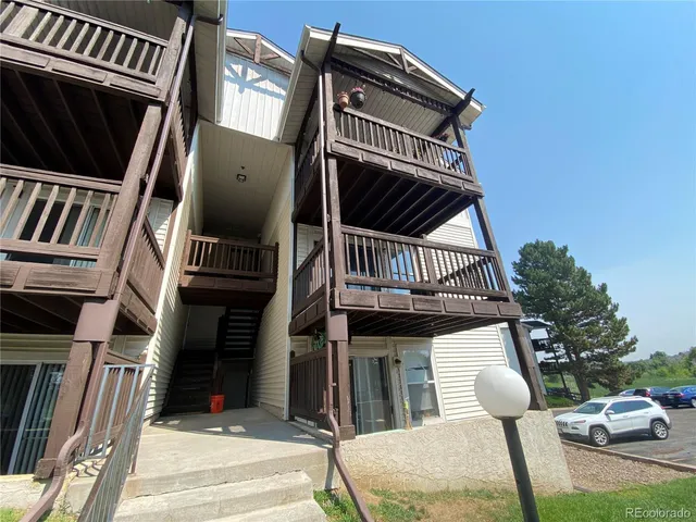 a view of balcony with furniture