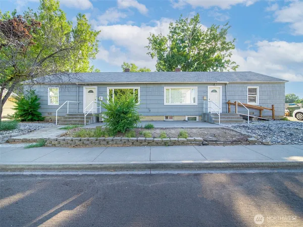 front view of a house with a yard