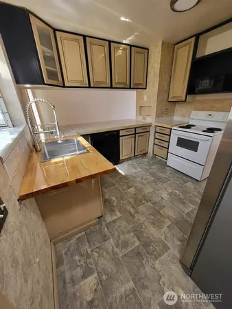 a kitchen with a stove and a microwave