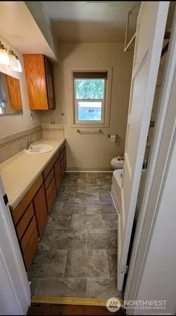 a bathroom with sink and mirror