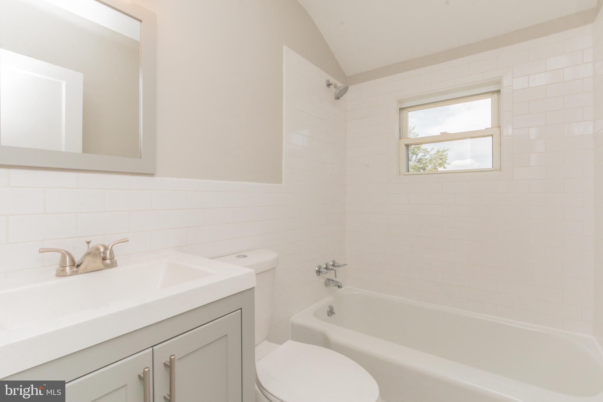 460 Stemmers Run Road Essex, MD 21221 - Photo 22 of 30 a bathroom with a sink toilet and bathtub