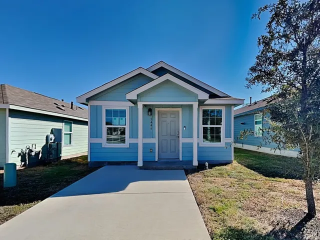 a front view of a house with a yard and porch