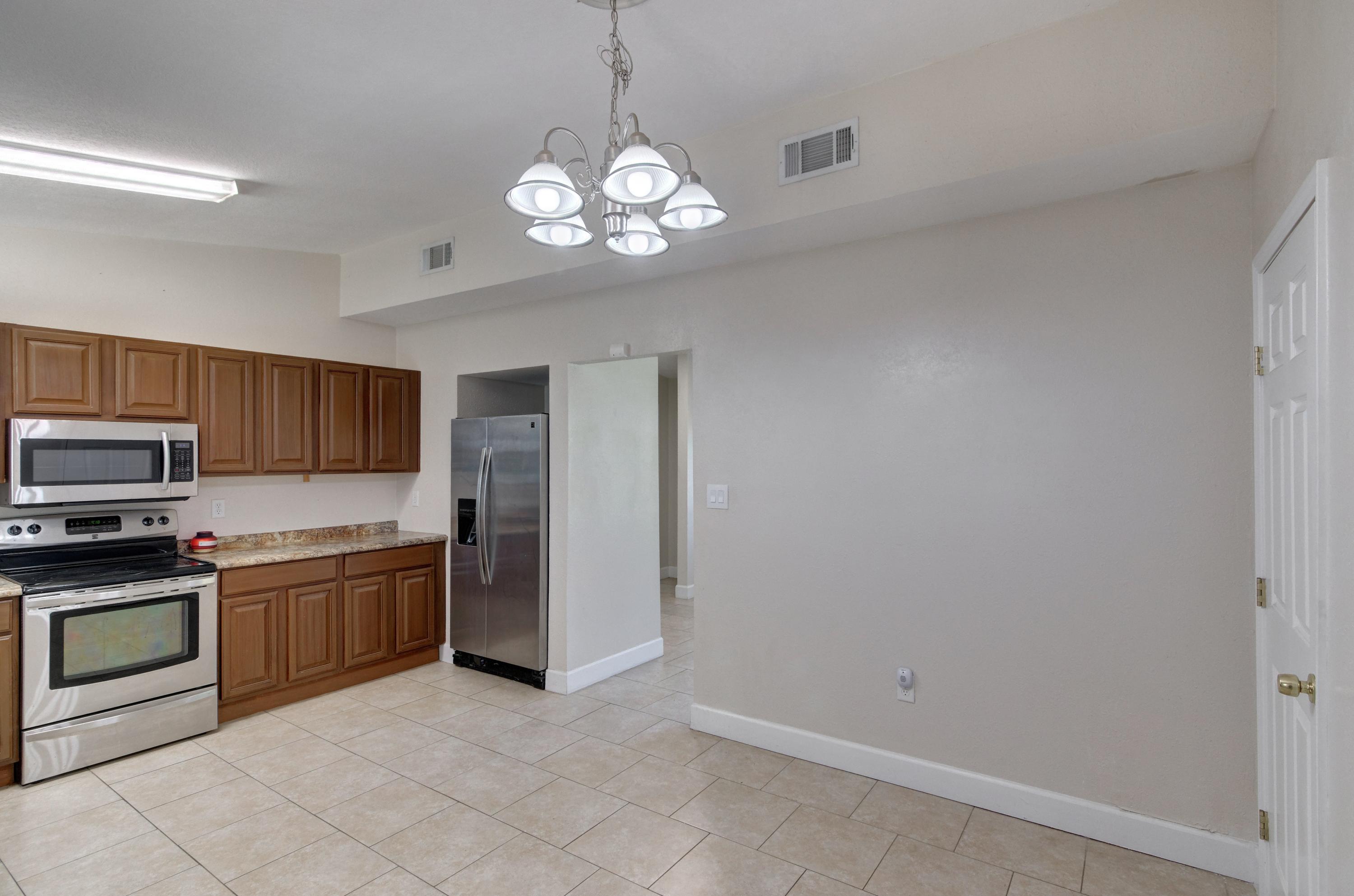 419 Westminster Road Fort Walton Beach, FL 32547 - Photo 12 of 40 a view of a kitchen with a sink and stainless steel appliances