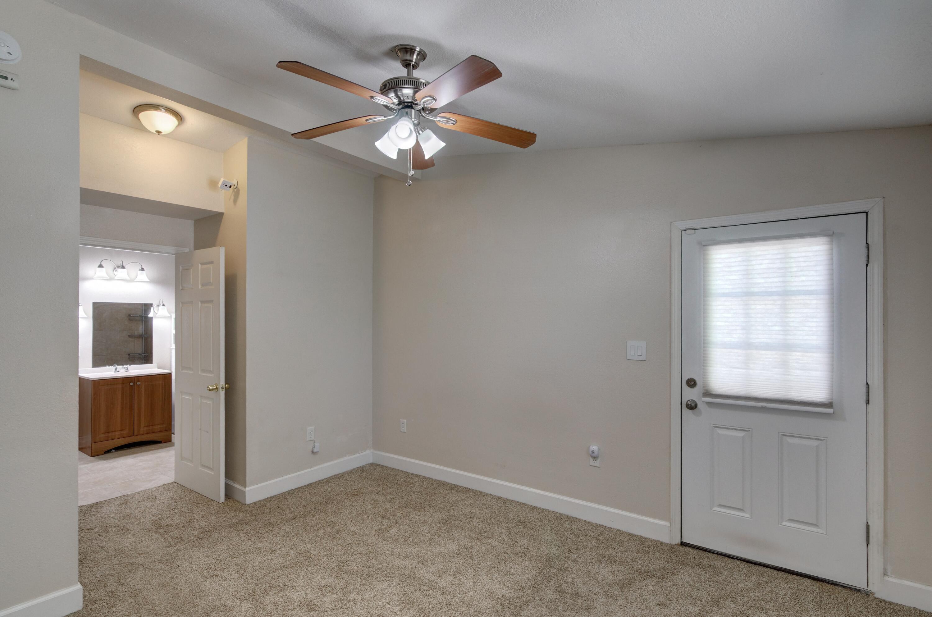 419 Westminster Road Fort Walton Beach, FL 32547 - Photo 16 of 40 an empty room with chandelier fan