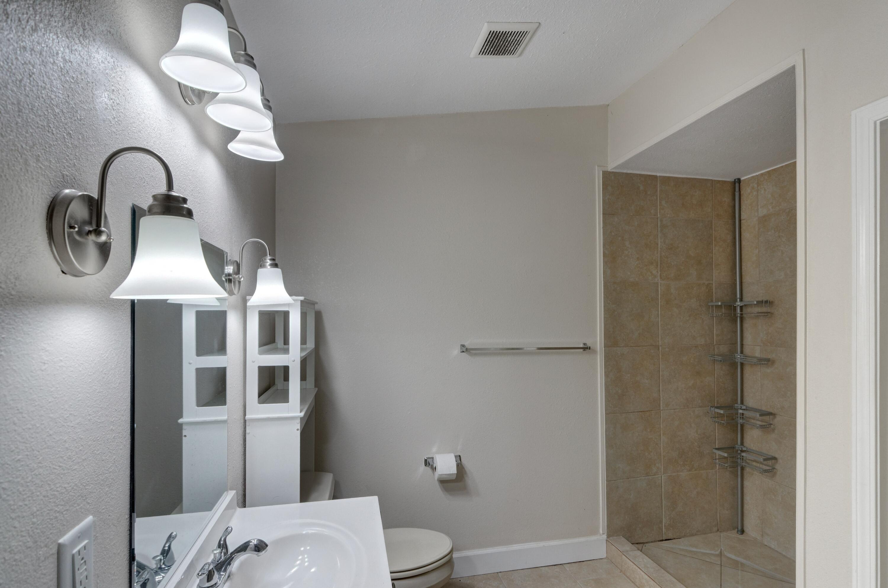 419 Westminster Road Fort Walton Beach, FL 32547 - Photo 20 of 40 a bathroom with a sink and a mirror
