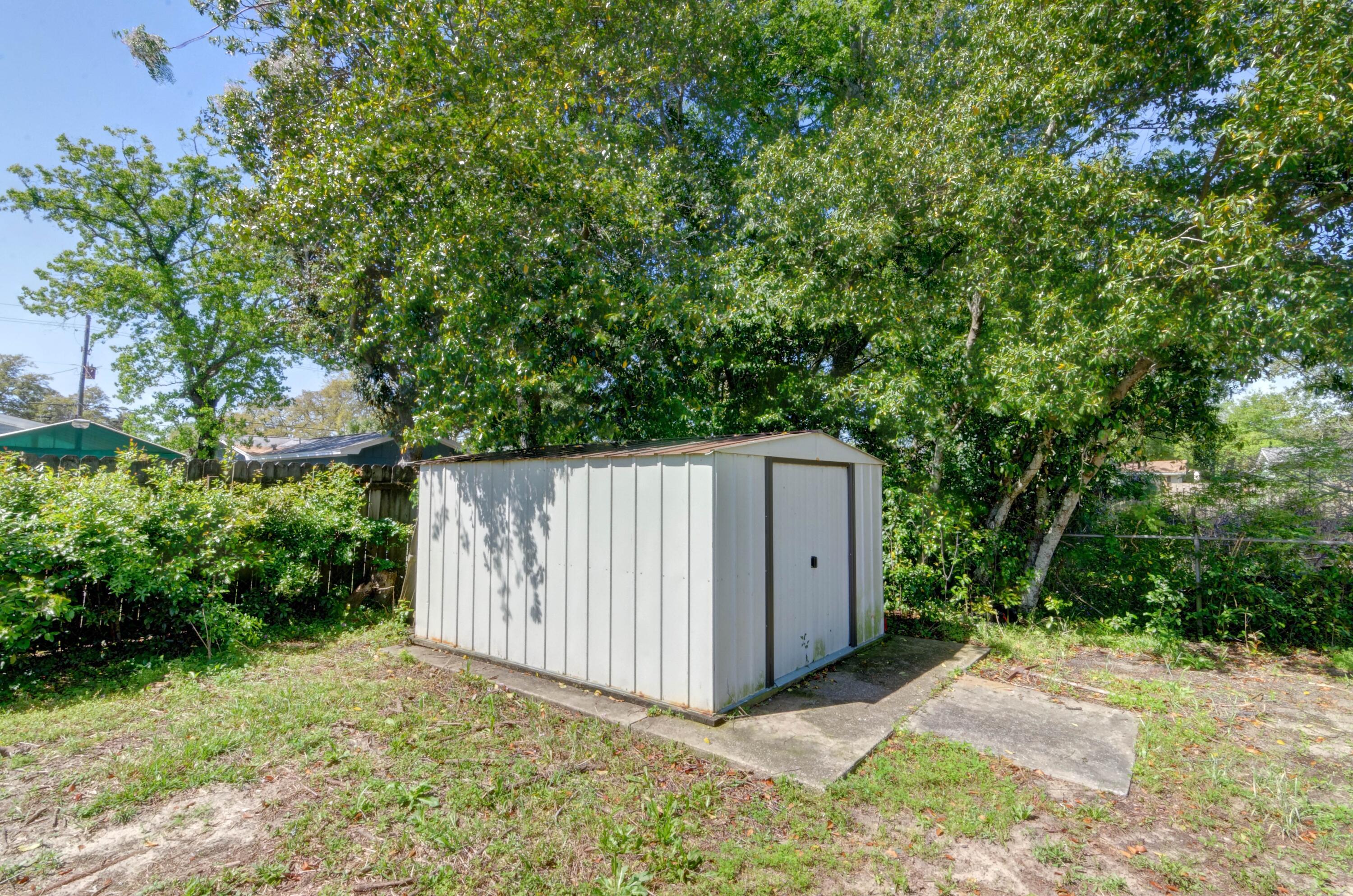 419 Westminster Road Fort Walton Beach, FL 32547 - Photo 37 of 40 a house with trees in front of it