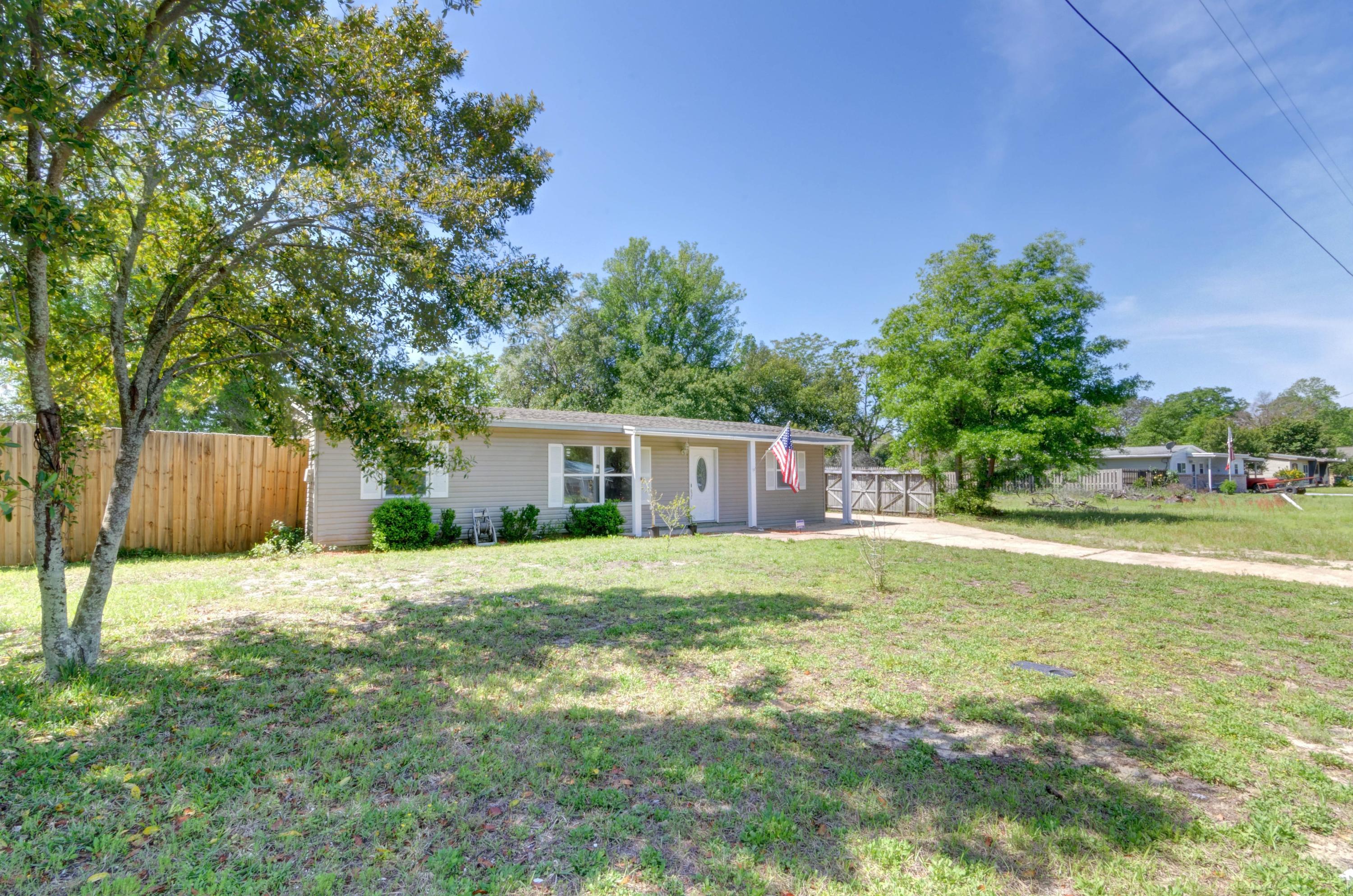 419 Westminster Road Fort Walton Beach, FL 32547 - Photo 40 of 40 a backyard of a house with lots of green space