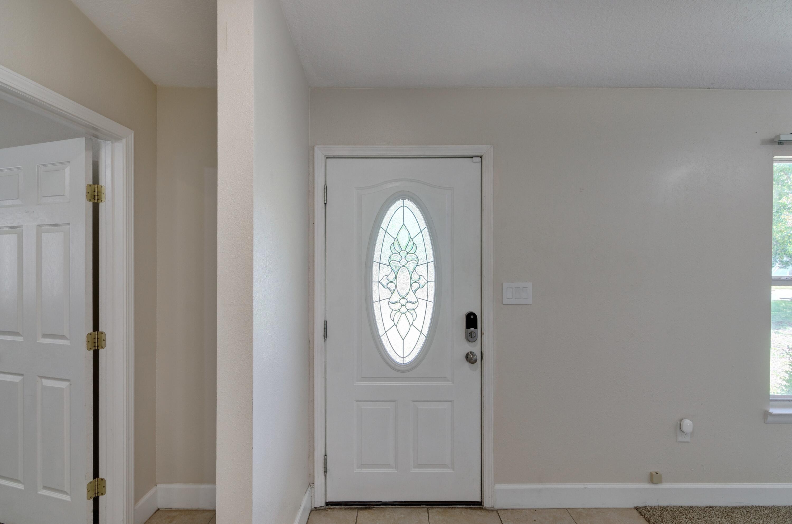 419 Westminster Road Fort Walton Beach, FL 32547 - Photo 5 of 40 a clock on a door with a clock on the wall