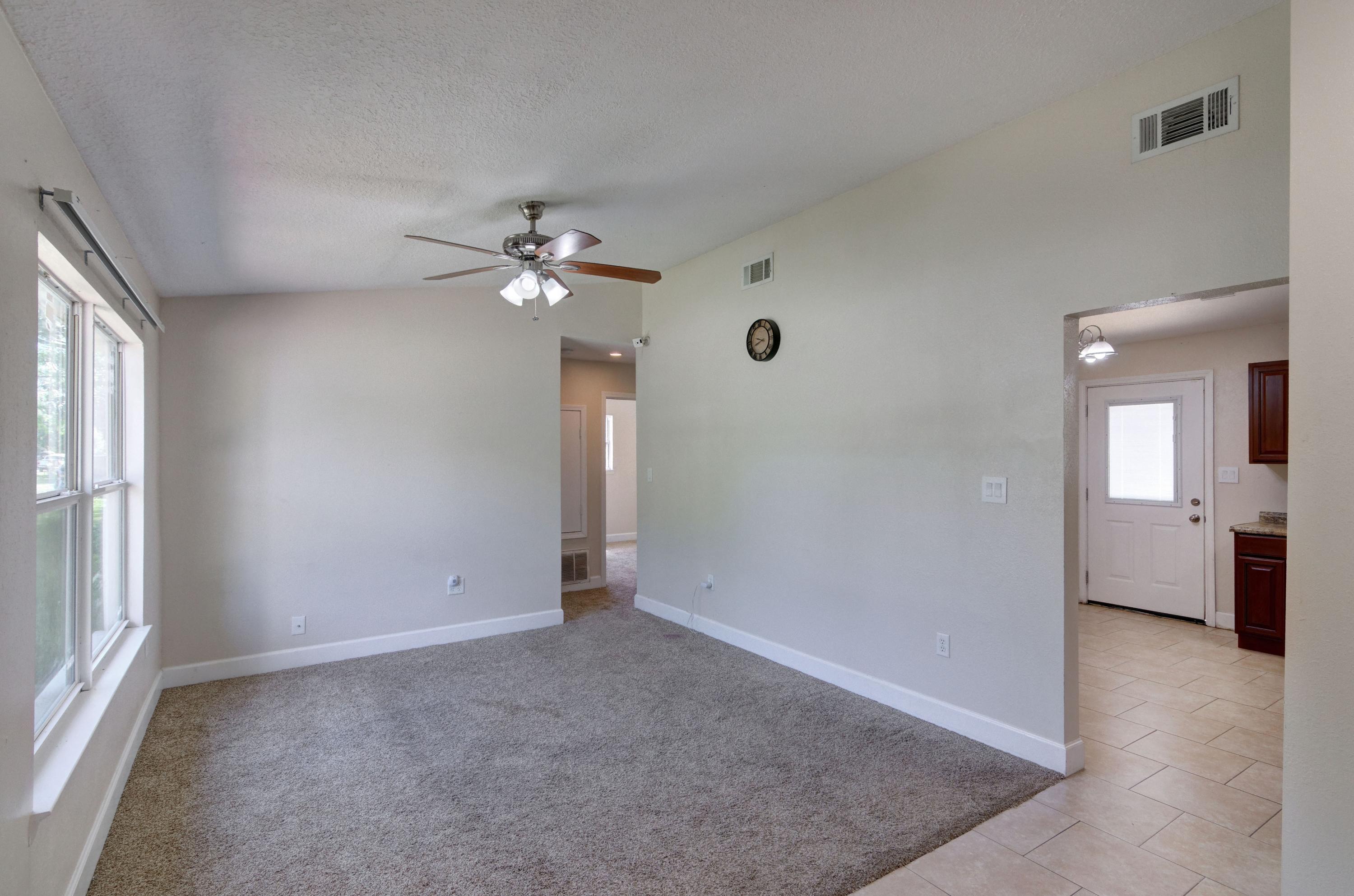 419 Westminster Road Fort Walton Beach, FL 32547 - Photo 6 of 40 an empty room with fan and windows