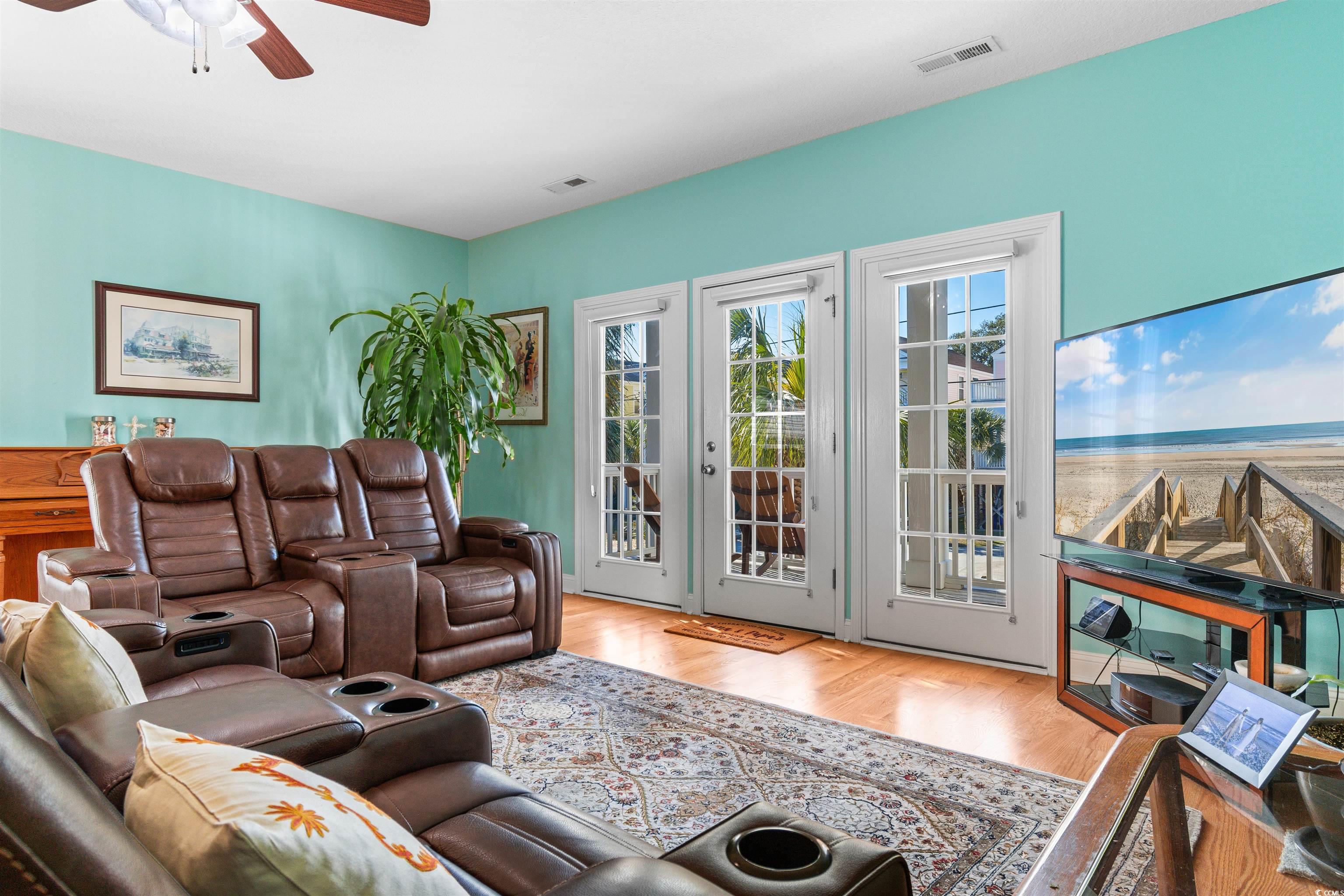 116 B 15th Avenue North Surfside Beach, SC 29575 - Photo 11 of 32 Living room featuring light wood-type flooring, ce
