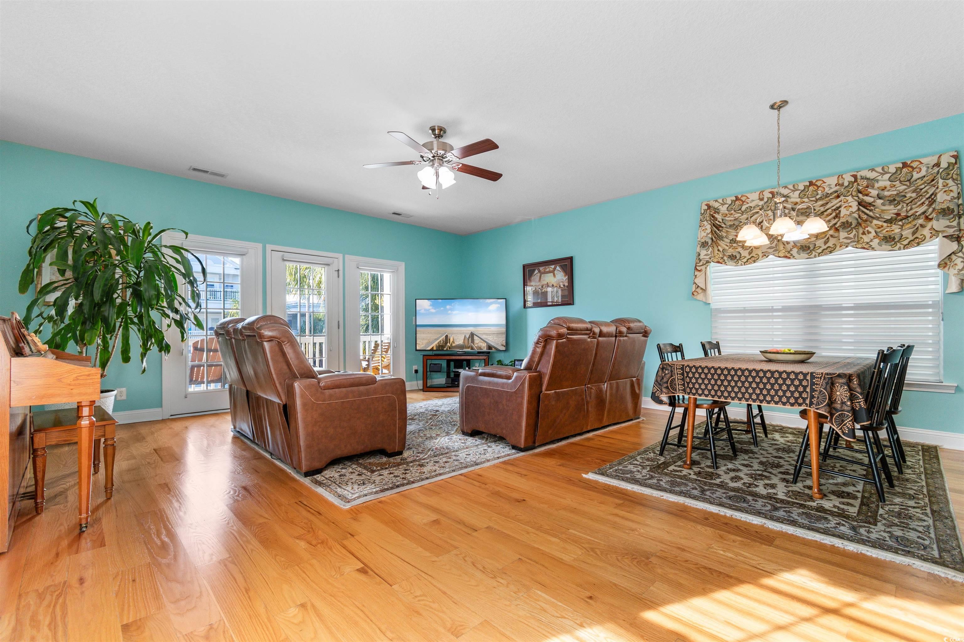 116 B 15th Avenue North Surfside Beach, SC 29575 - Photo 12 of 32 Living room featuring wood-type flooring and ceili