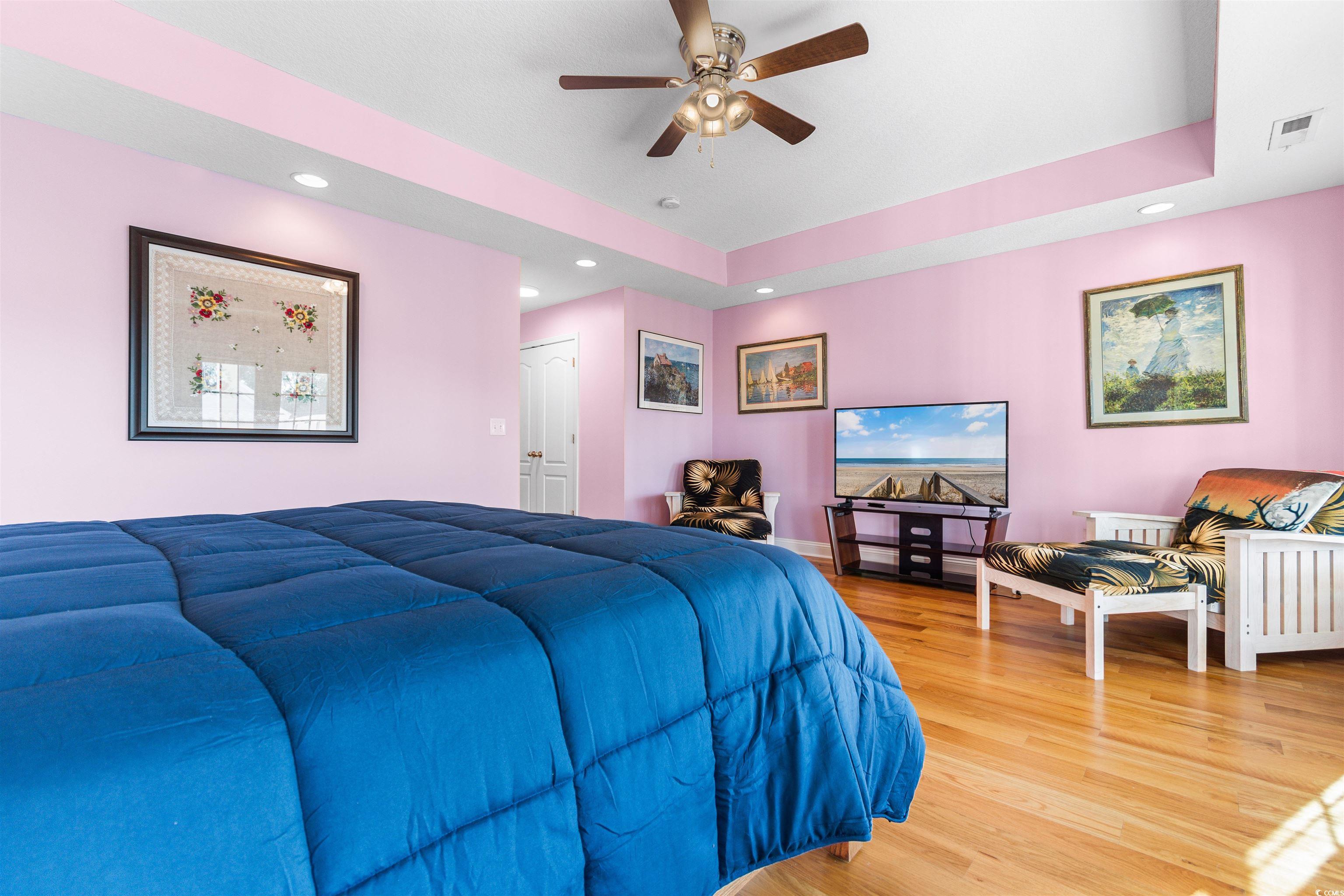 116 B 15th Avenue North Surfside Beach, SC 29575 - Photo 14 of 32 Bedroom with ceiling fan, wood-type flooring, a tr