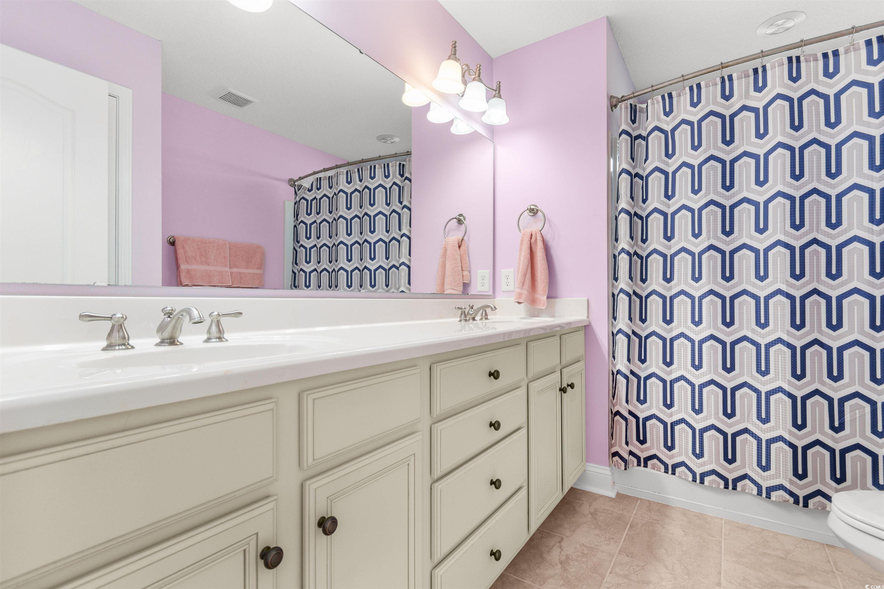 116 B 15th Avenue North Surfside Beach, SC 29575 - Photo 15 of 32 Full bathroom with tile patterned floors, toilet,