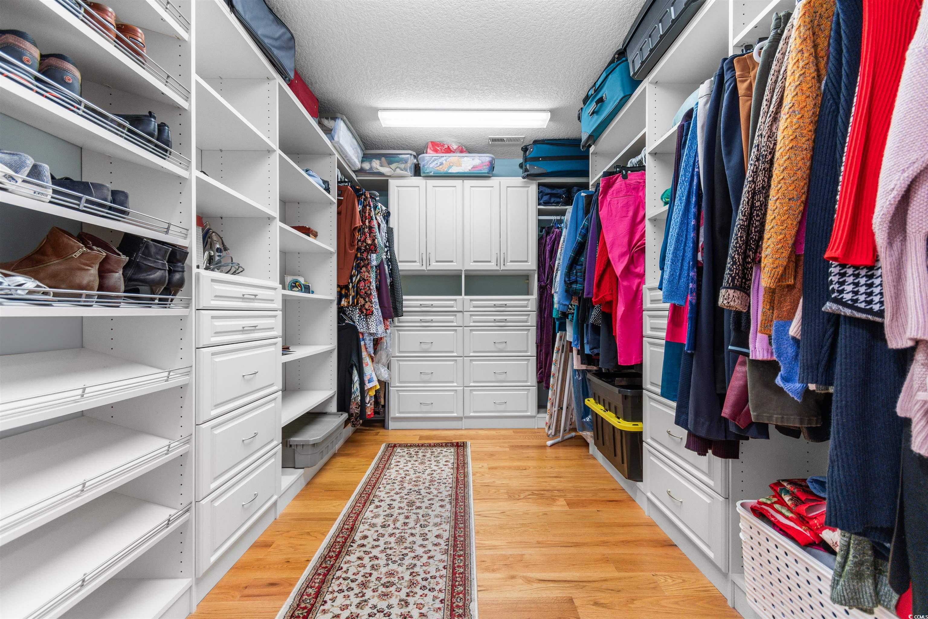 116 B 15th Avenue North Surfside Beach, SC 29575 - Photo 16 of 32 Walk in closet with light hardwood / wood-style fl