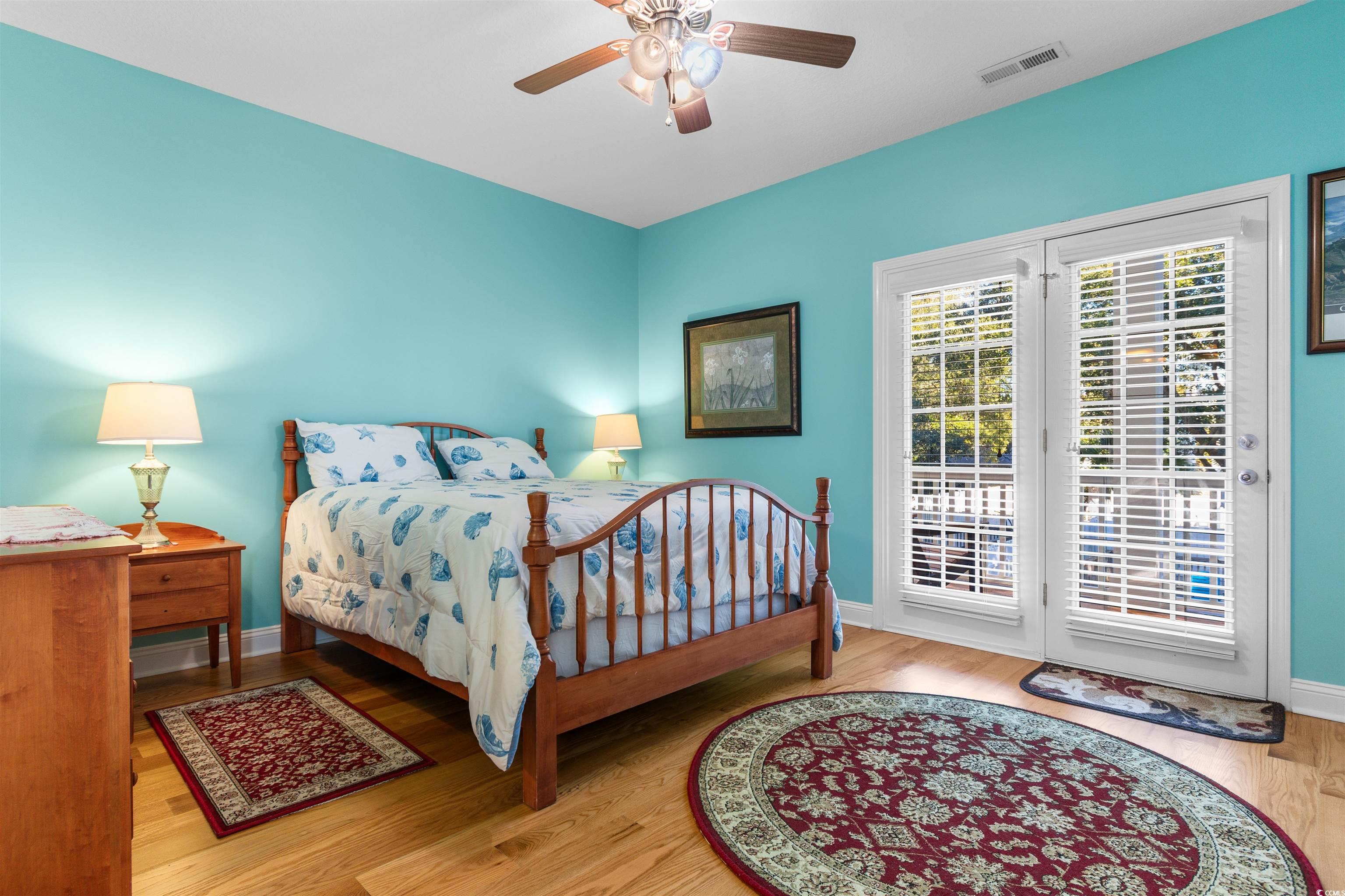 116 B 15th Avenue North Surfside Beach, SC 29575 - Photo 17 of 32 Bedroom with ceiling fan, access to exterior, and
