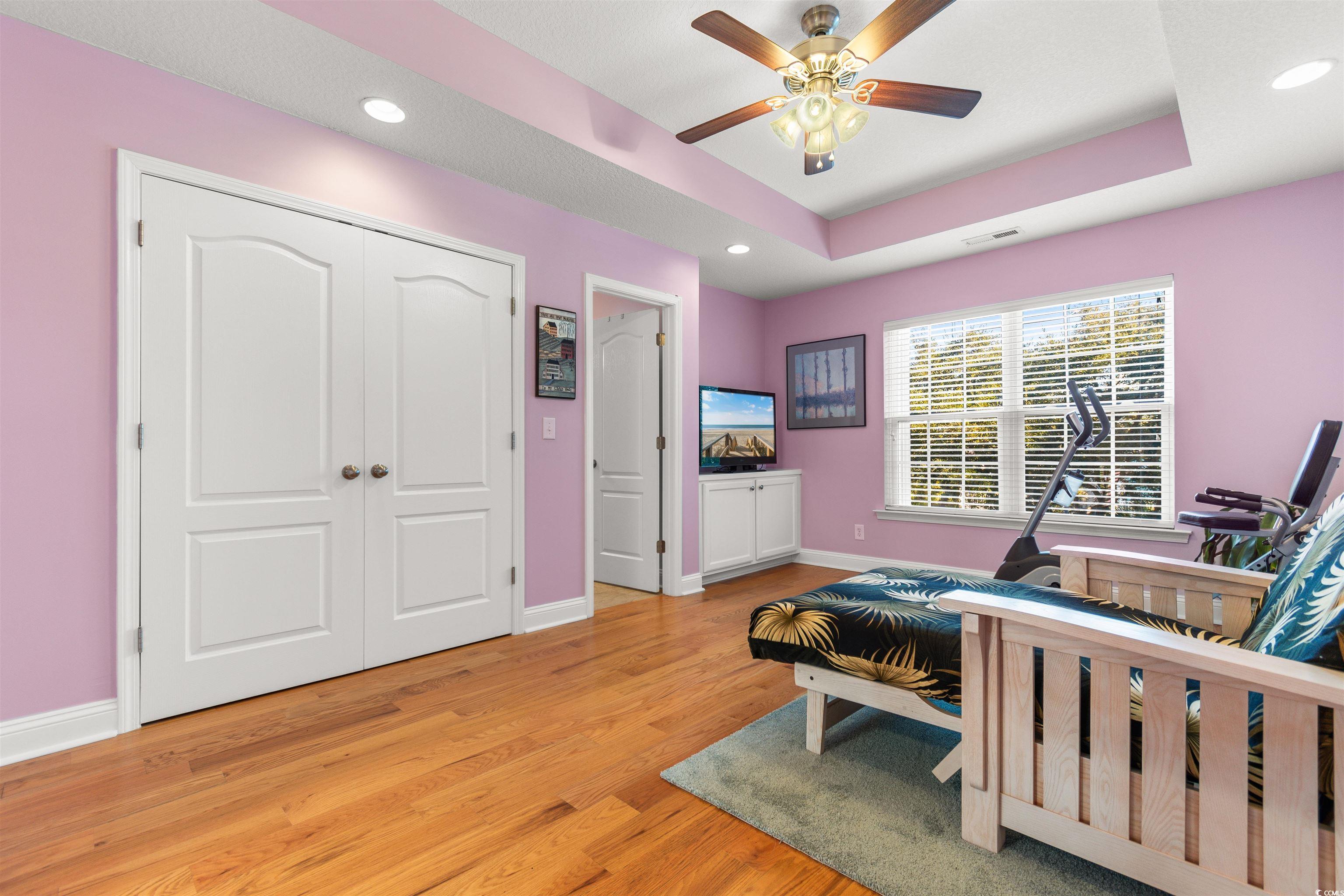 116 B 15th Avenue North Surfside Beach, SC 29575 - Photo 20 of 32 Bedroom with ceiling fan, a closet, light hardwood