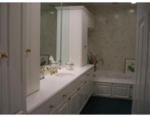 75 Salem Road Topsfield, MA 01983 - Photo 17 of 25 a bathroom with a sink and a mirror