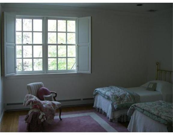 75 Salem Road Topsfield, MA 01983 - Photo 20 of 25 a bedroom with a bed and a window