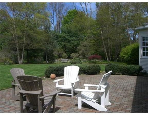 75 Salem Road Topsfield, MA 01983 - Photo 24 of 25 a view of a patio with table and chairs potted plants and a garden