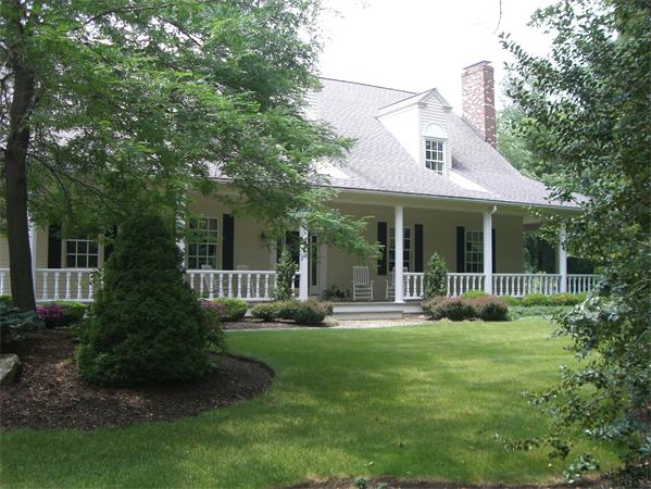75 Salem Road Topsfield, MA 01983 - Photo 4 of 25 a view of a house with sitting area and garden
