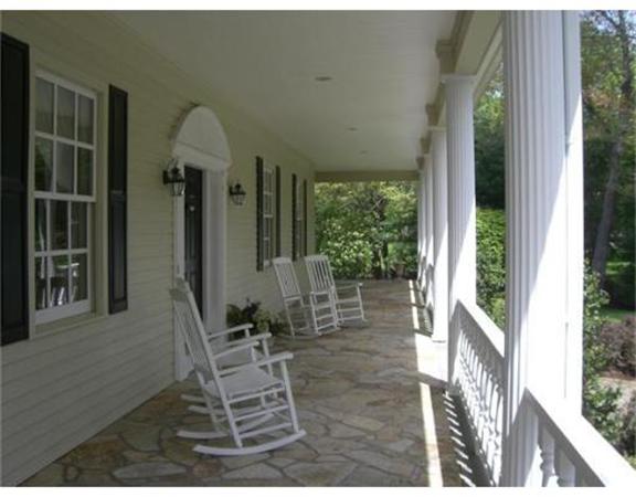 75 Salem Road Topsfield, MA 01983 - Photo 8 of 25 a porch area with table and chairs