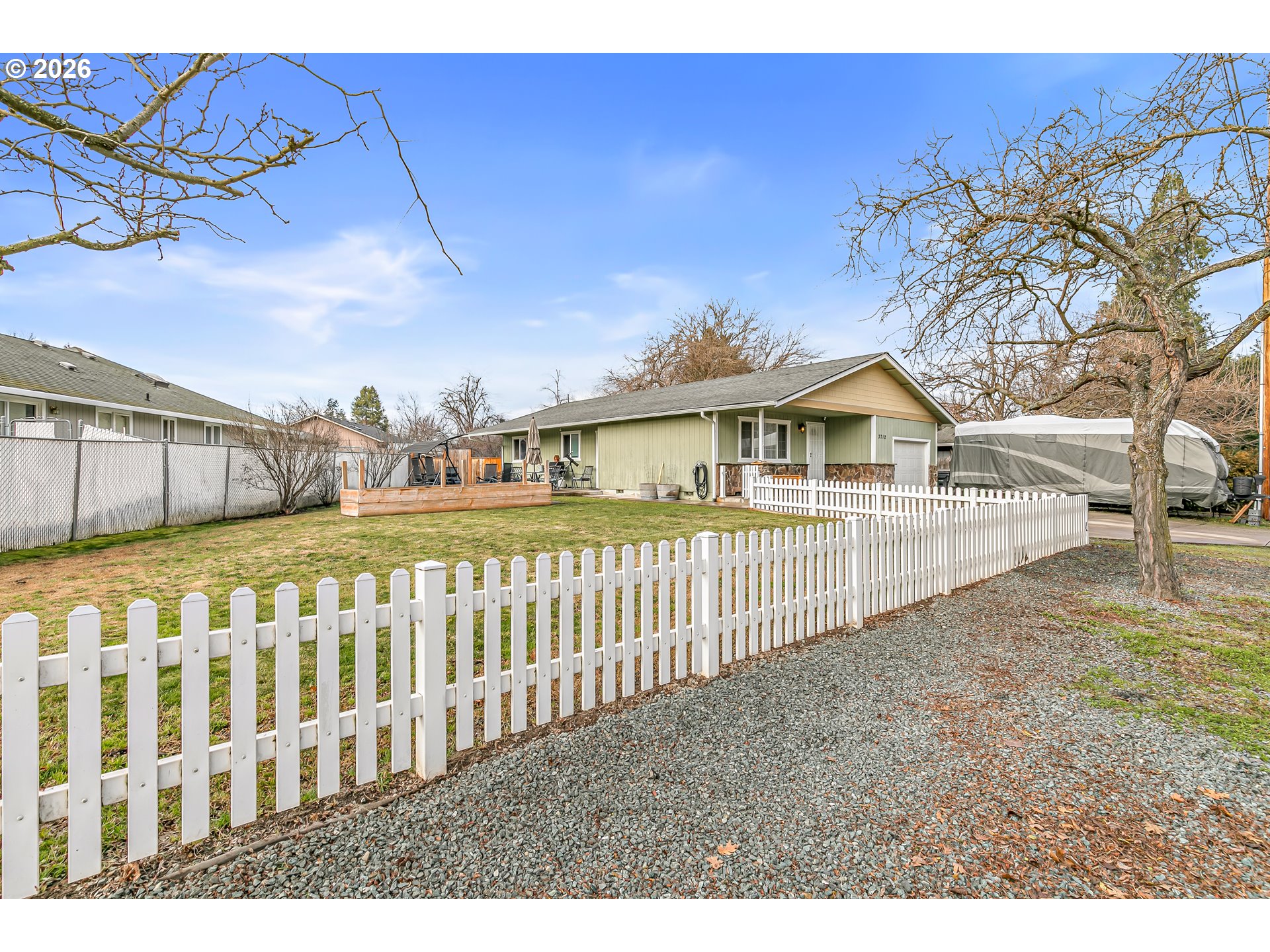 3712 Colver Road Phoenix, OR 97535 - Photo 26 of 38 a view of a house with a wooden fence