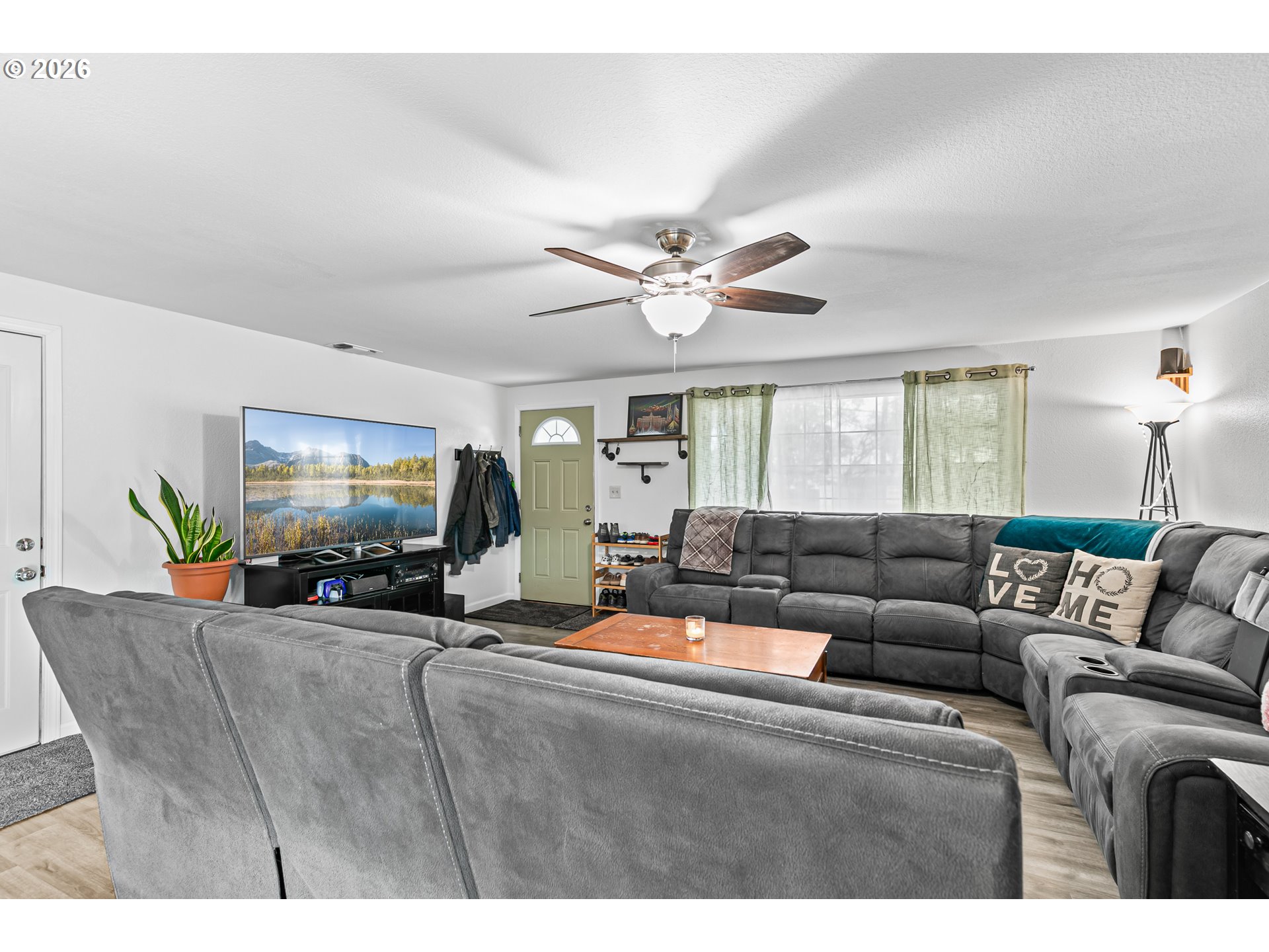 3712 Colver Road Phoenix, OR 97535 - Photo 4 of 38 a living room with furniture and a flat screen tv