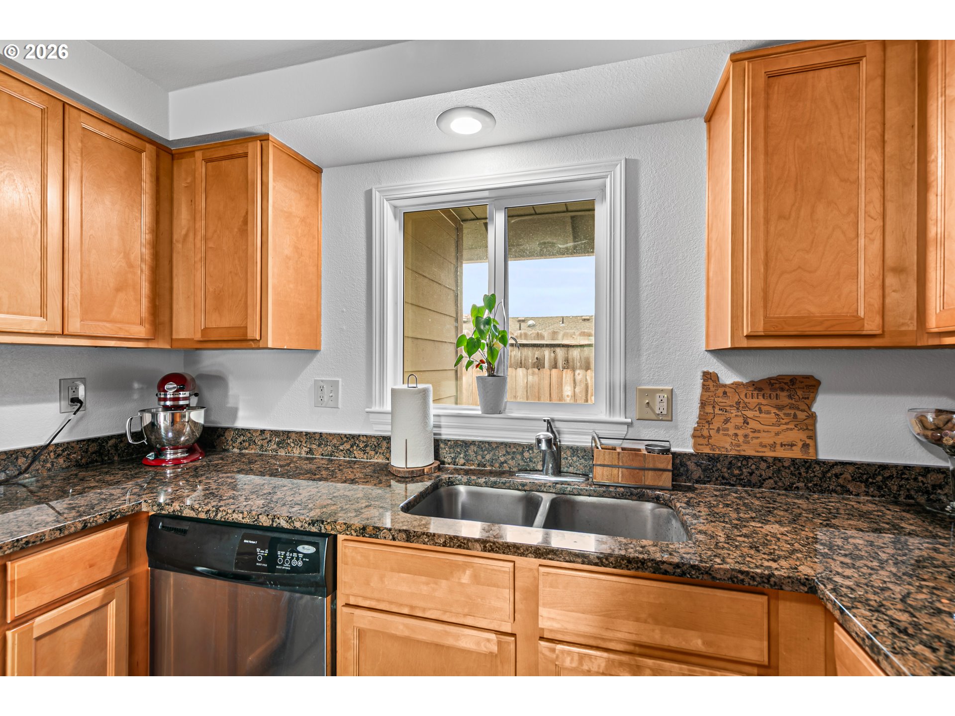 3712 Colver Road Phoenix, OR 97535 - Photo 10 of 38 a kitchen with stainless steel appliances granite countertop a sink stove and cabinets