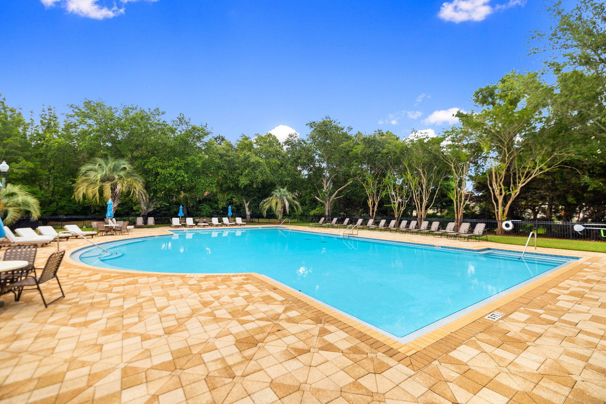 236 Mattie's Way Destin, FL 32541 - Photo 145 of 156 a view of a swimming pool with an outdoor space and seating area