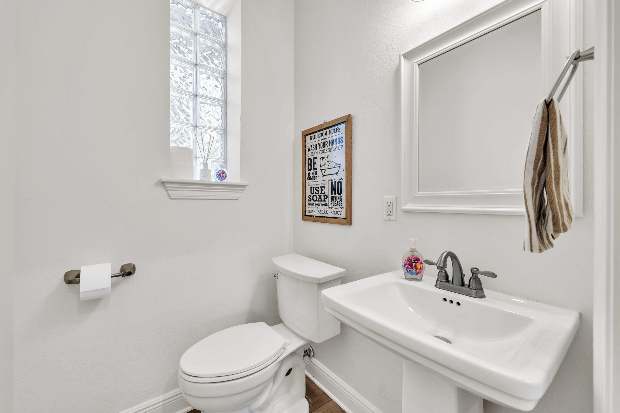 236 Mattie's Way Destin, FL 32541 - Photo 149 of 156 a white toilet sitting next to a bathroom sink