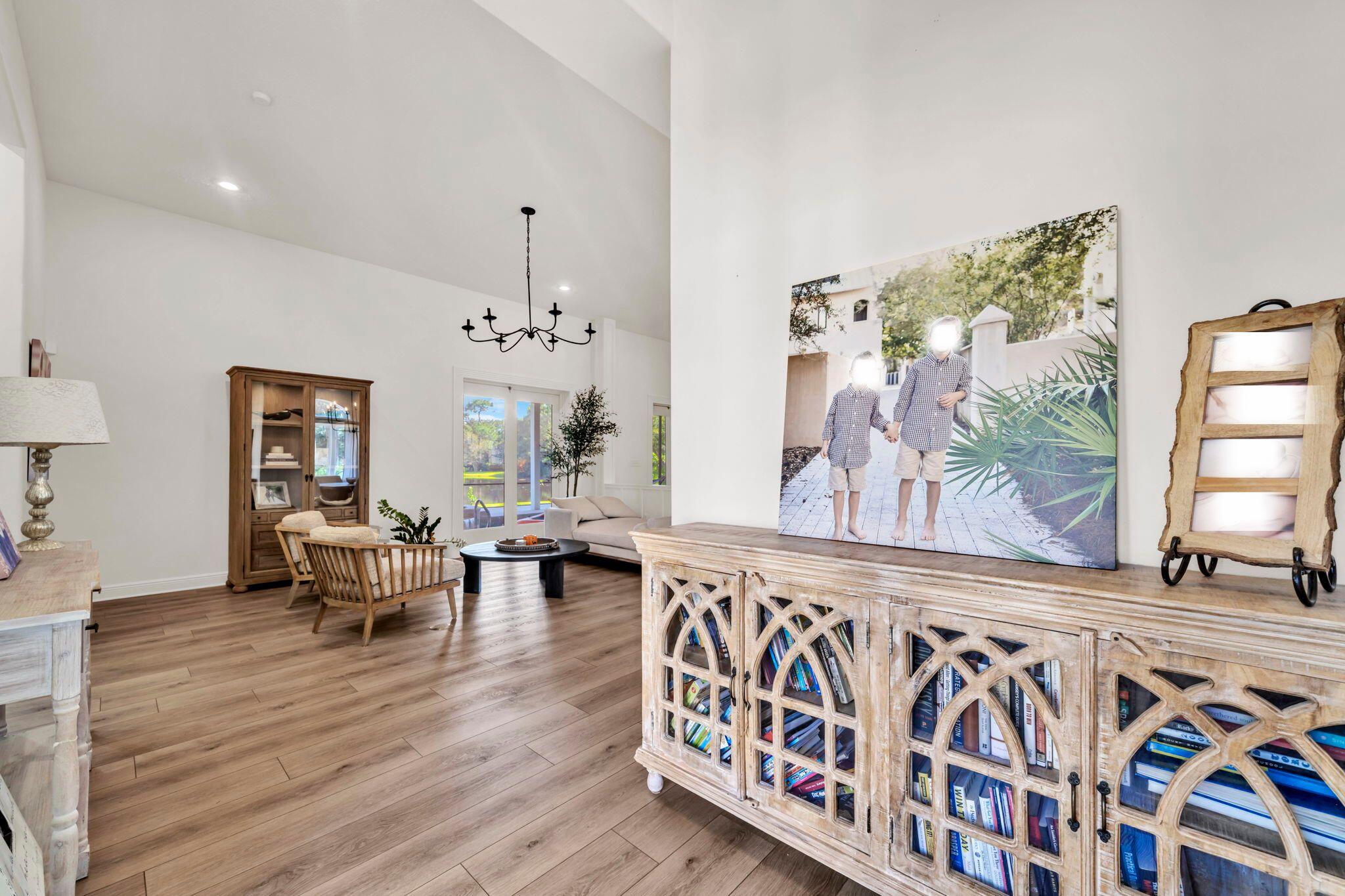 236 Mattie's Way Destin, FL 32541 - Photo 152 of 156 a living room with furniture and painting on the wall