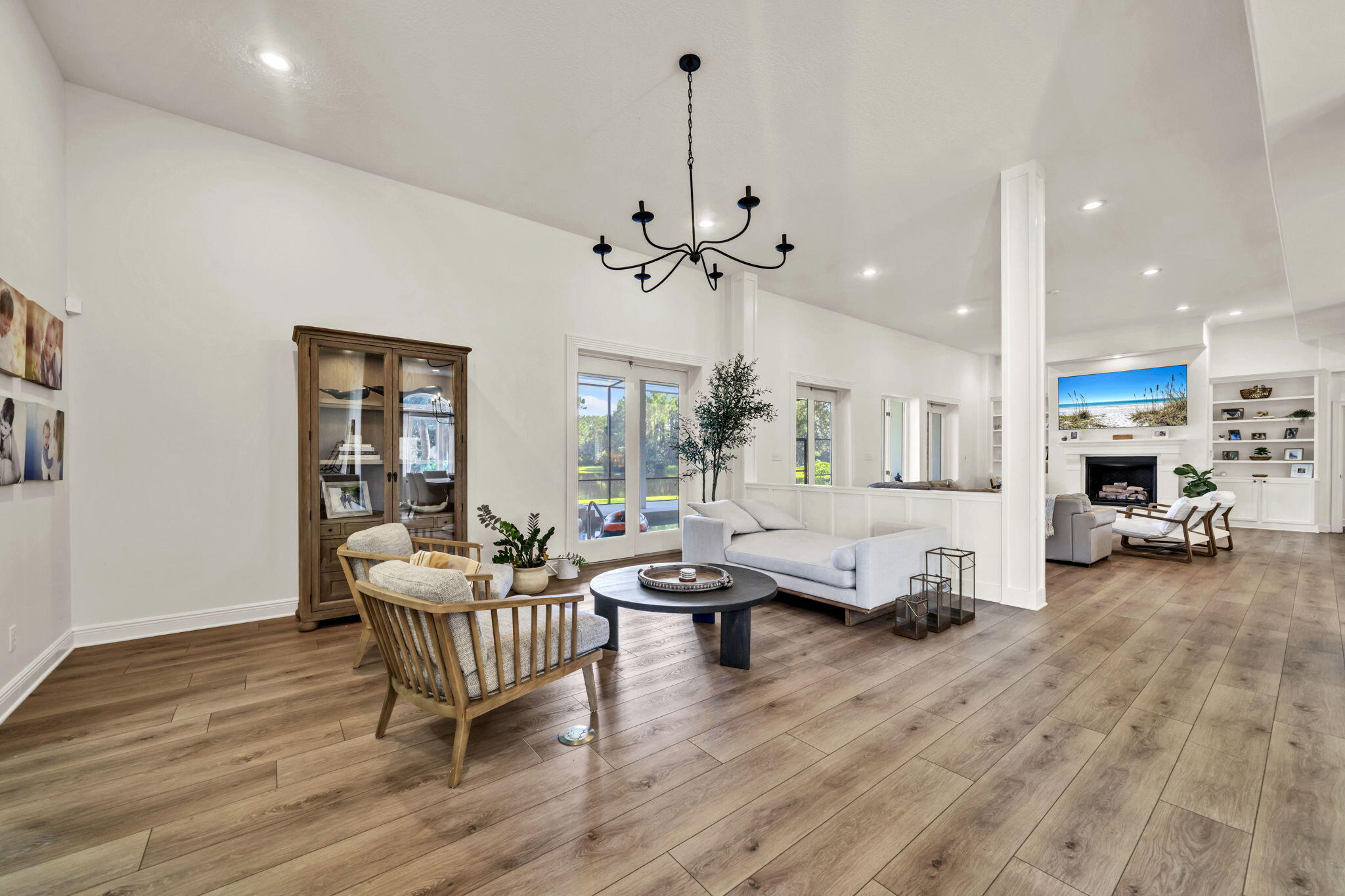 236 Mattie's Way Destin, FL 32541 - Photo 25 of 156 a living room with furniture and a chandelier