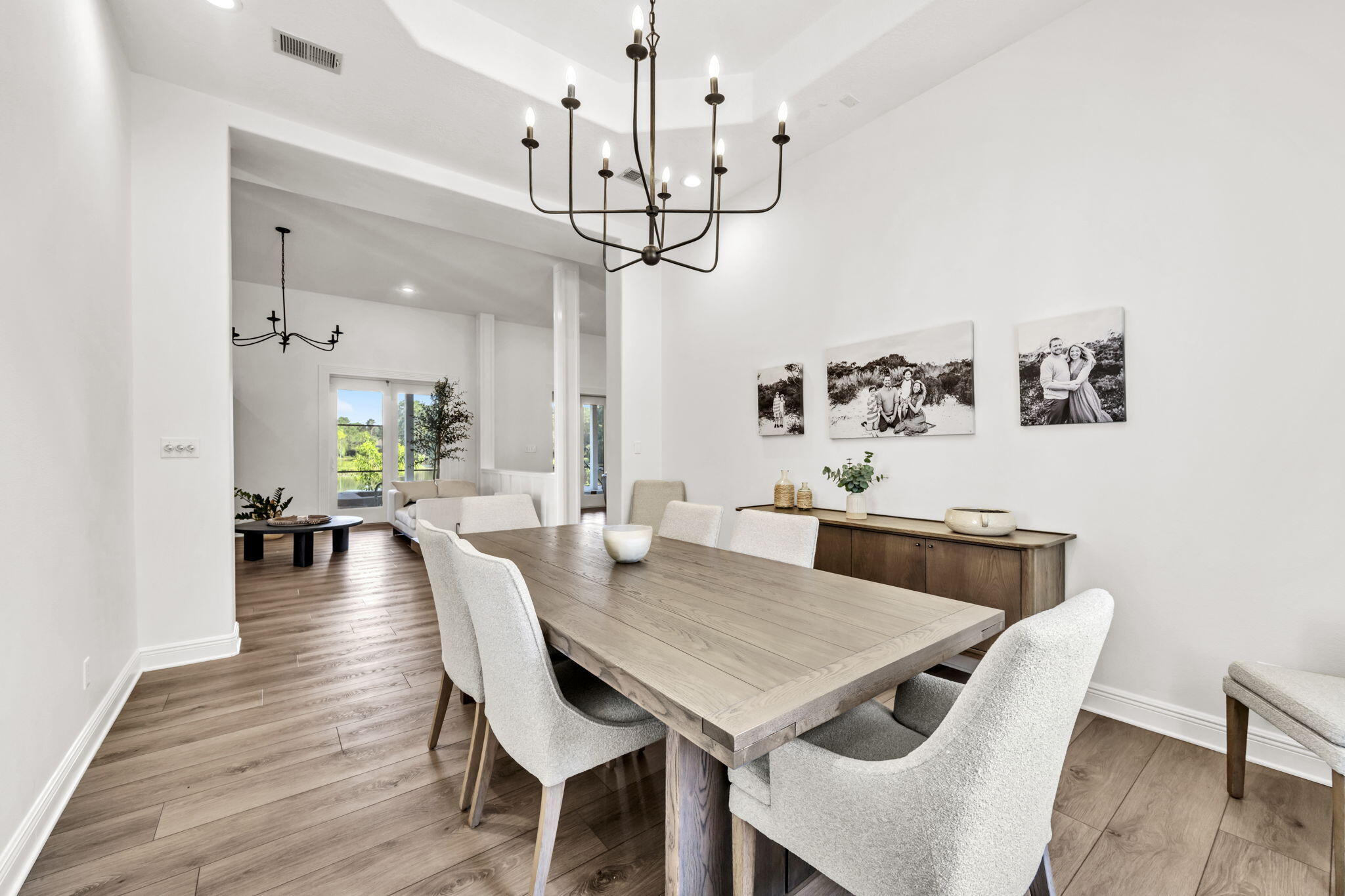 236 Mattie's Way Destin, FL 32541 - Photo 29 of 156 a view of a dining room with furniture wooden floor and chandelier