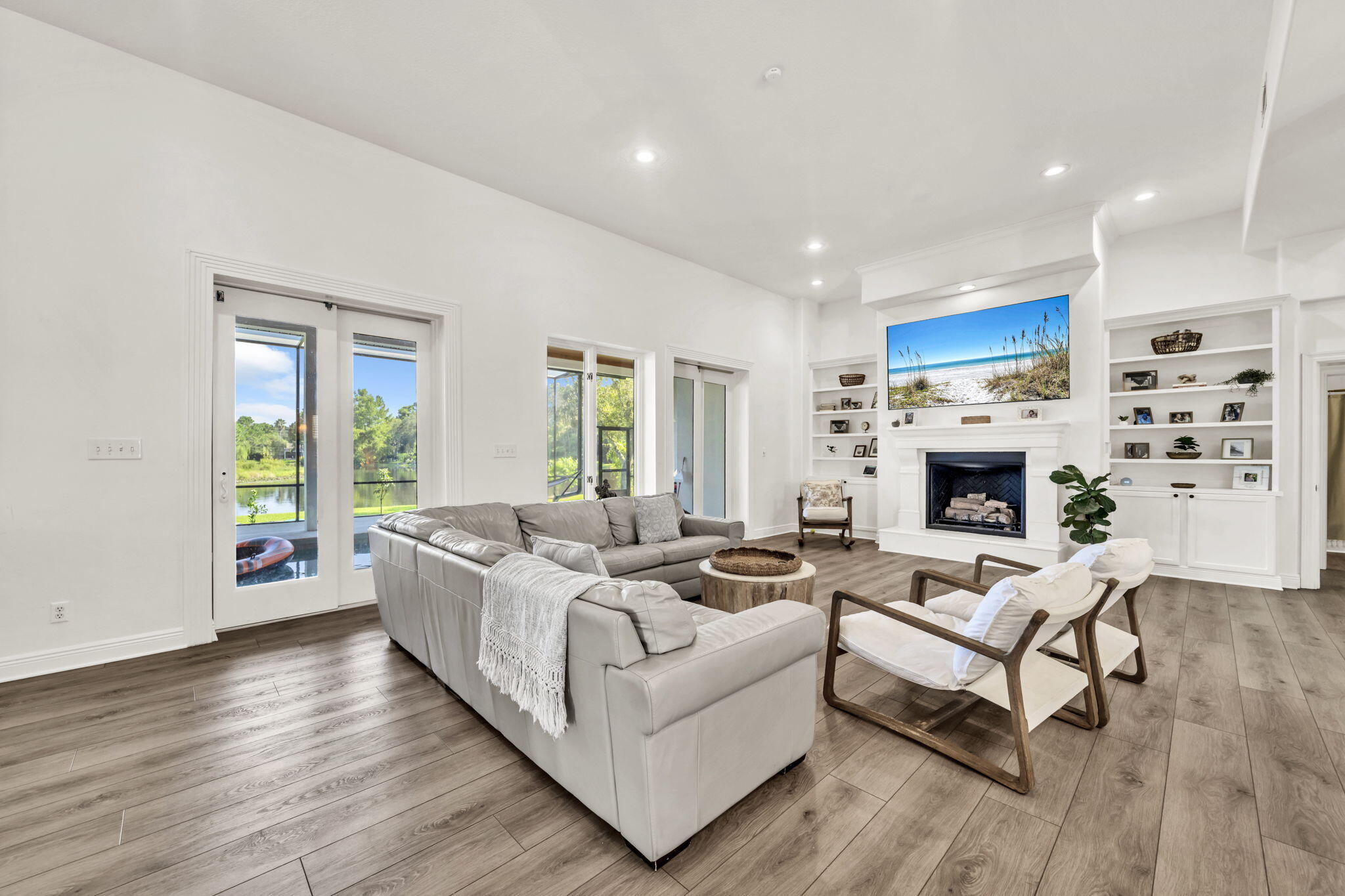 236 Mattie's Way Destin, FL 32541 - Photo 30 of 156 a living room with furniture fireplace and a large window