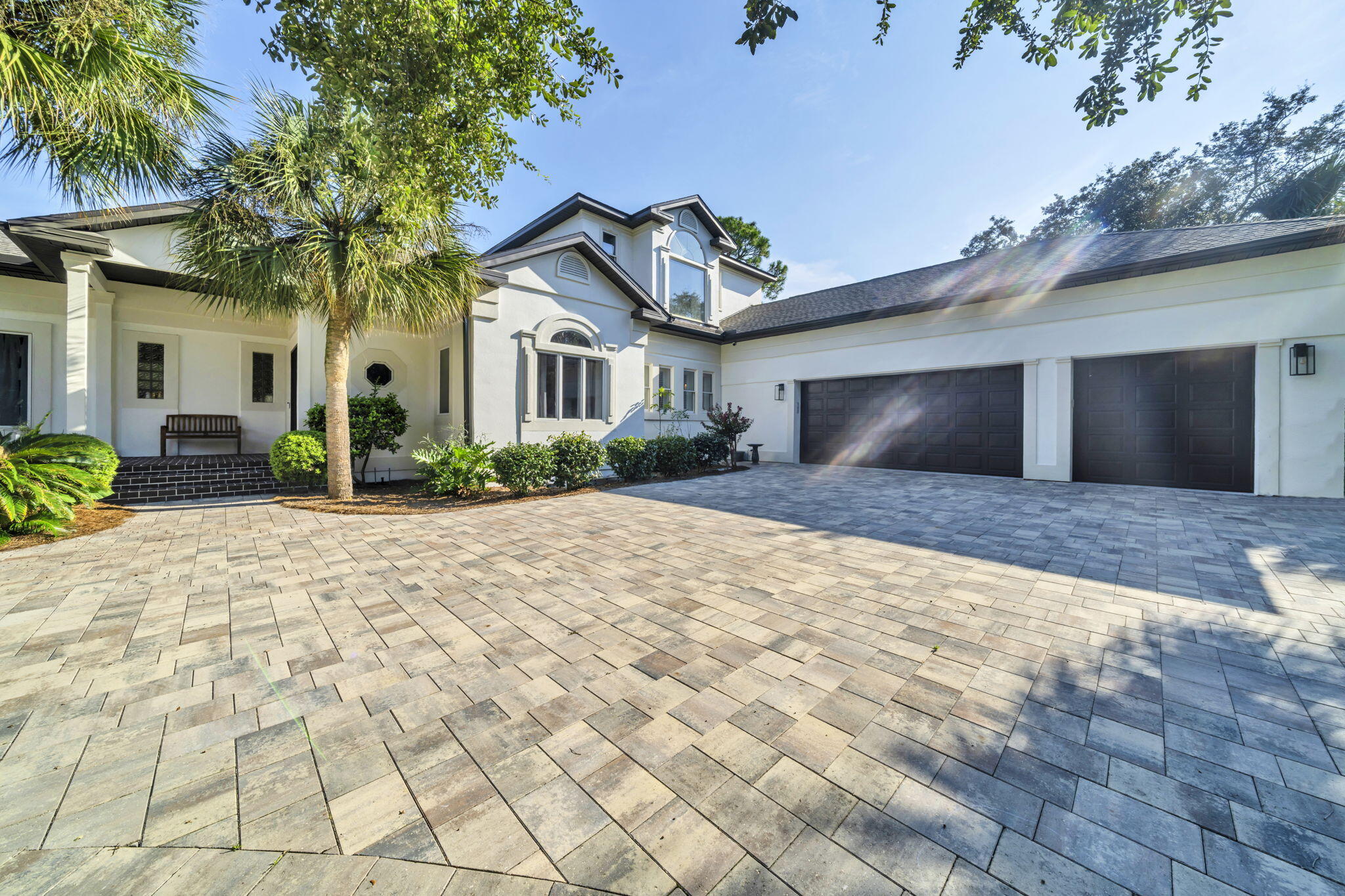 236 Mattie's Way Destin, FL 32541 - Photo 3 of 156 a front view of a house with garden