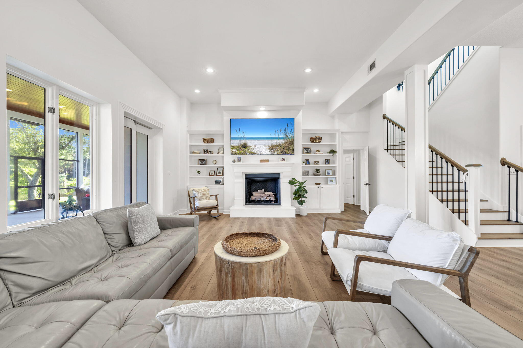 236 Mattie's Way Destin, FL 32541 - Photo 31 of 156 a living room with furniture and a fireplace