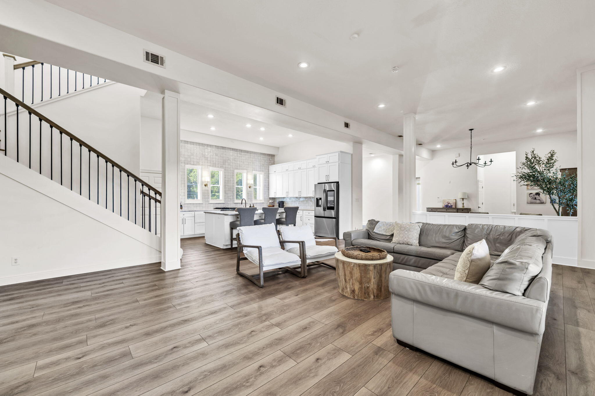 236 Mattie's Way Destin, FL 32541 - Photo 33 of 156 a living room with furniture and a wooden floor