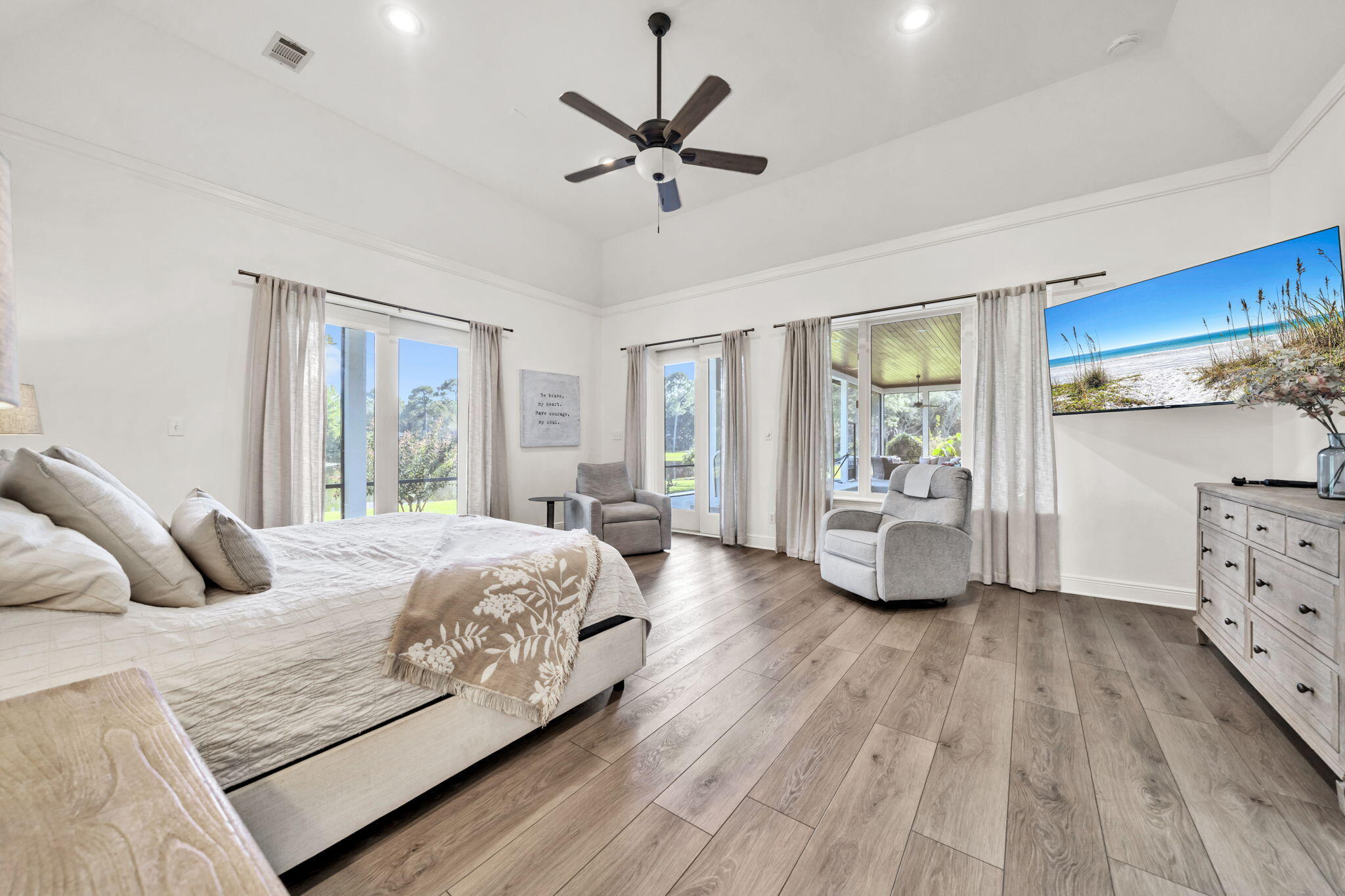 236 Mattie's Way Destin, FL 32541 - Photo 35 of 156 a bedroom with a large bed and a window