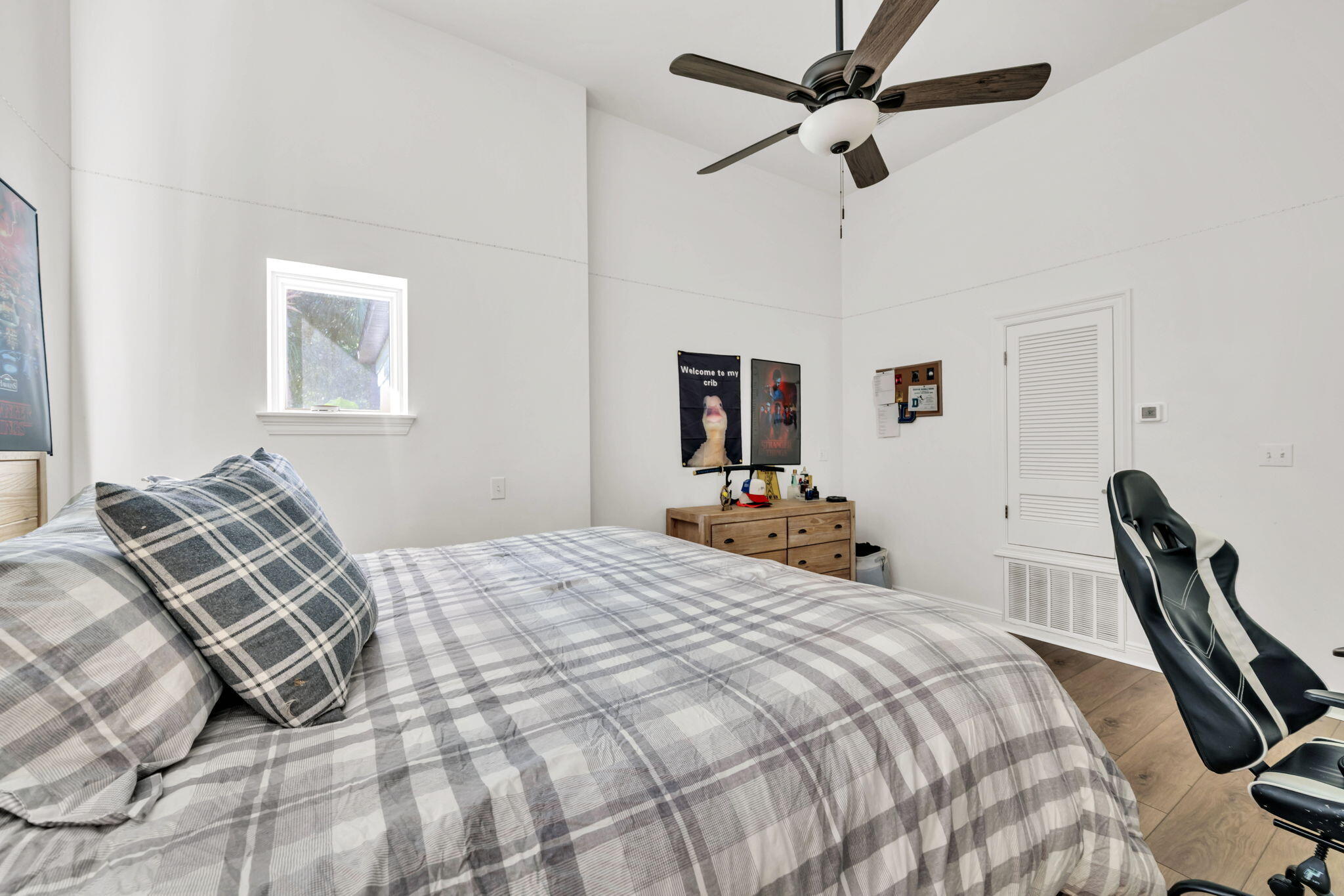 236 Mattie's Way Destin, FL 32541 - Photo 48 of 156 a bedroom with a bed ceiling fan and a window