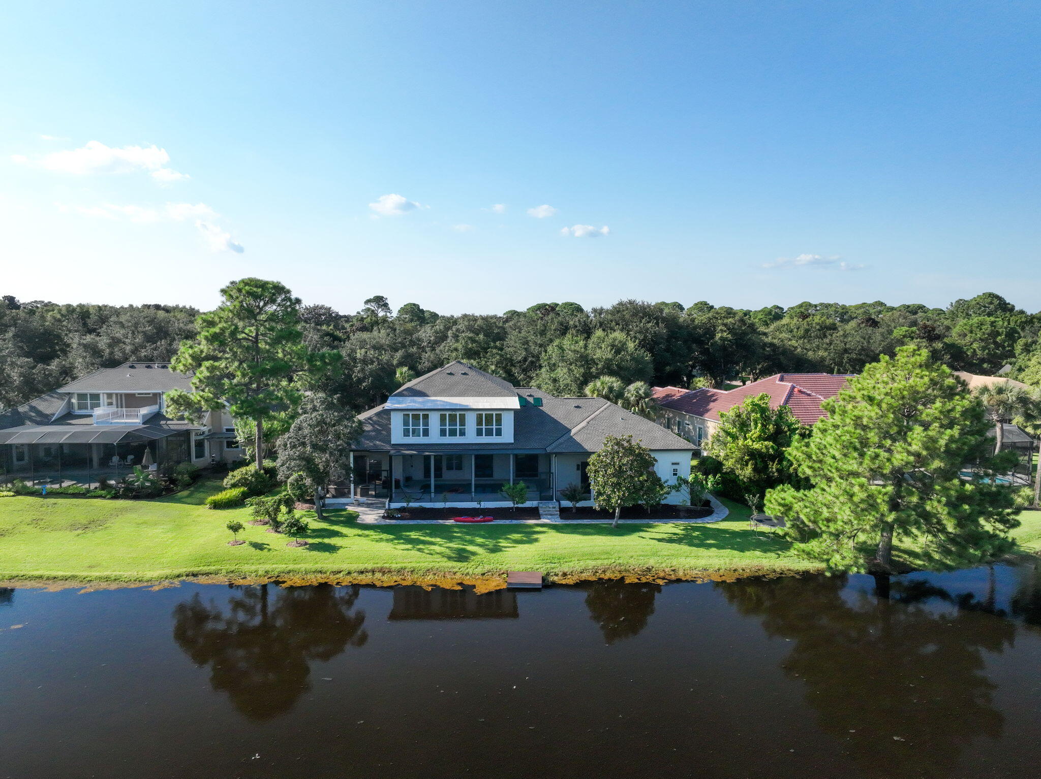 236 Mattie's Way Destin, FL 32541 - Photo 5 of 156 a view of a swimming pool with a garden