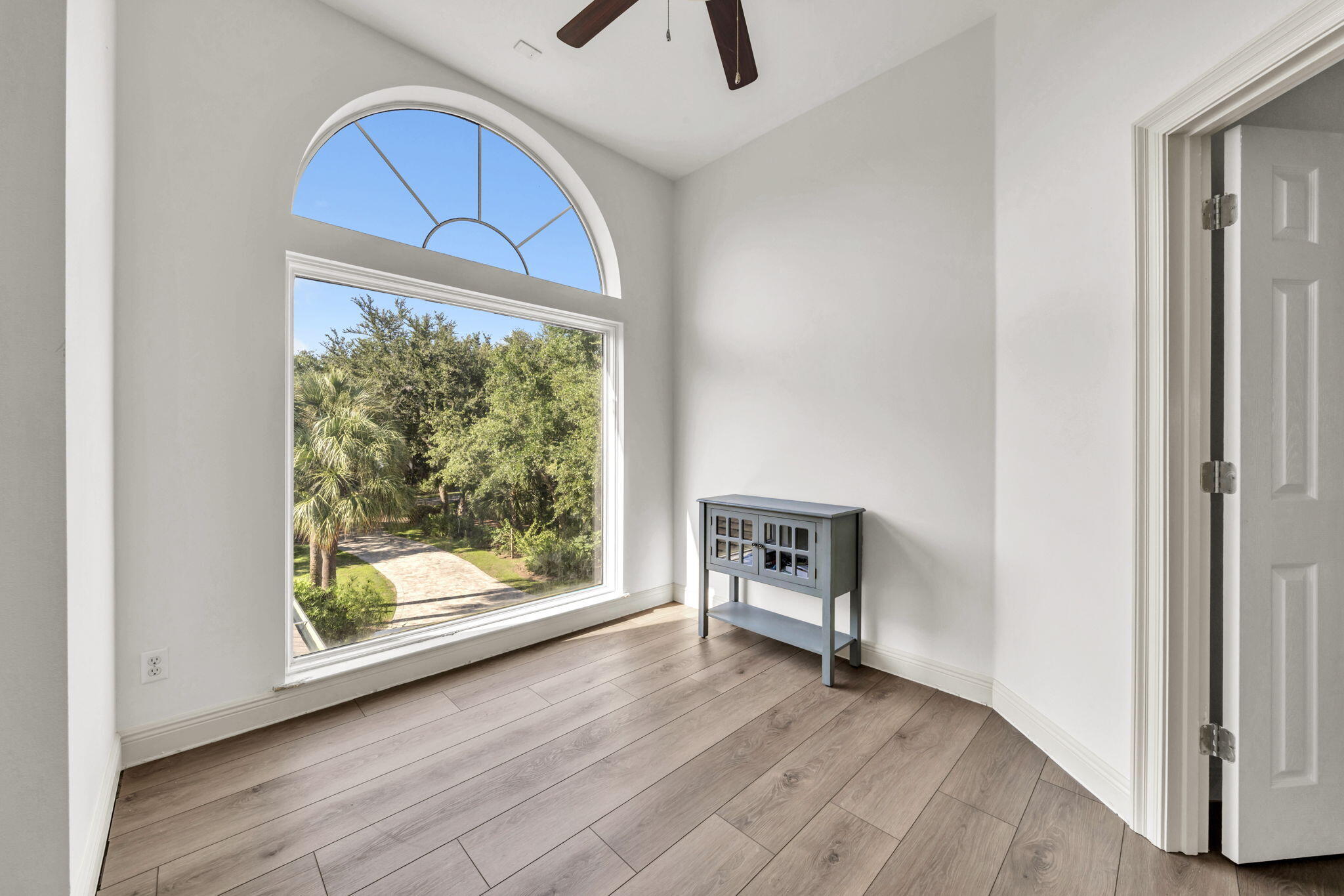 236 Mattie's Way Destin, FL 32541 - Photo 53 of 156 a view of room with window and wooden floor