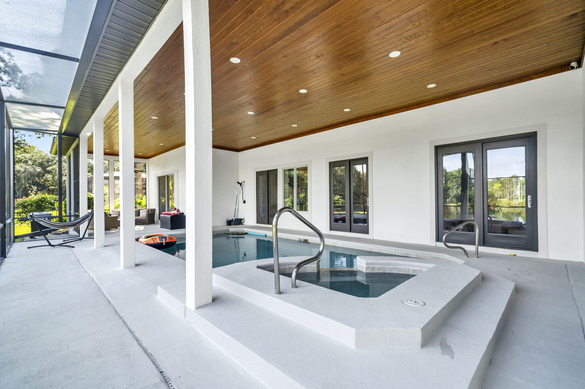 236 Mattie's Way Destin, FL 32541 - Photo 6 of 156 a view of living room with patio furniture and floor to ceiling window