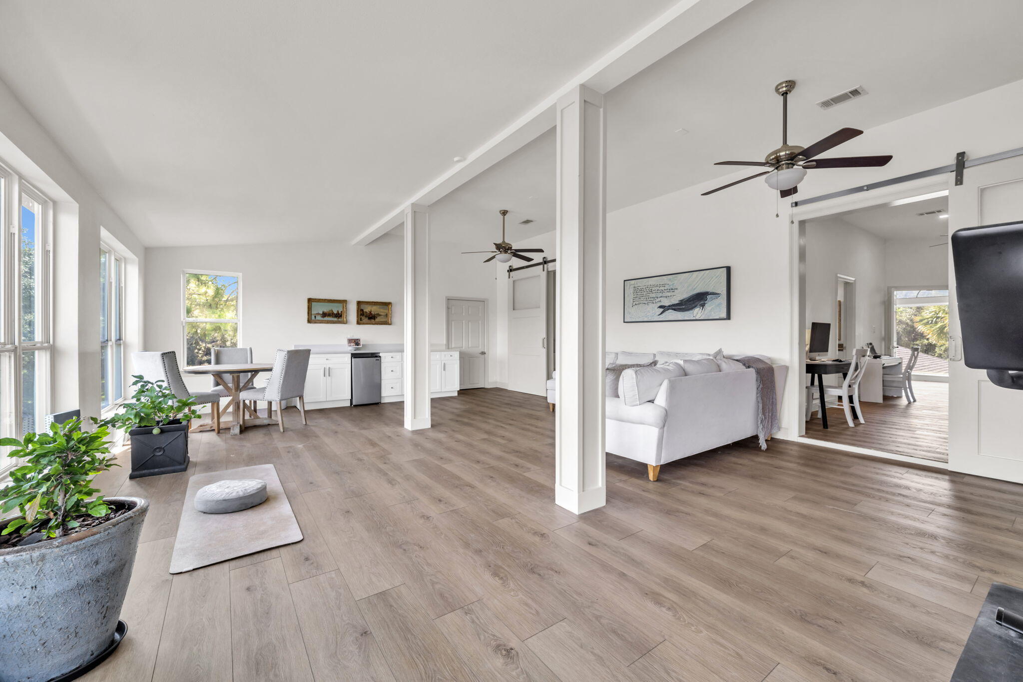 236 Mattie's Way Destin, FL 32541 - Photo 63 of 156 a living room with furniture and a large window