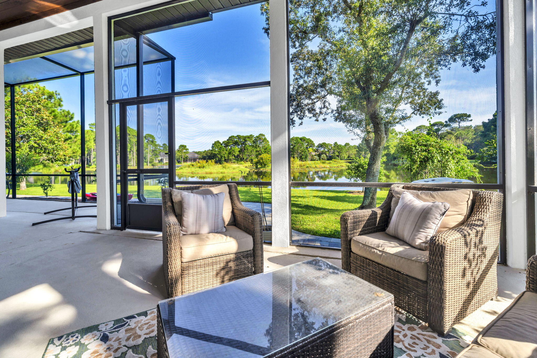 236 Mattie's Way Destin, FL 32541 - Photo 74 of 156 a view of a patio with couches chairs potted plants and city view