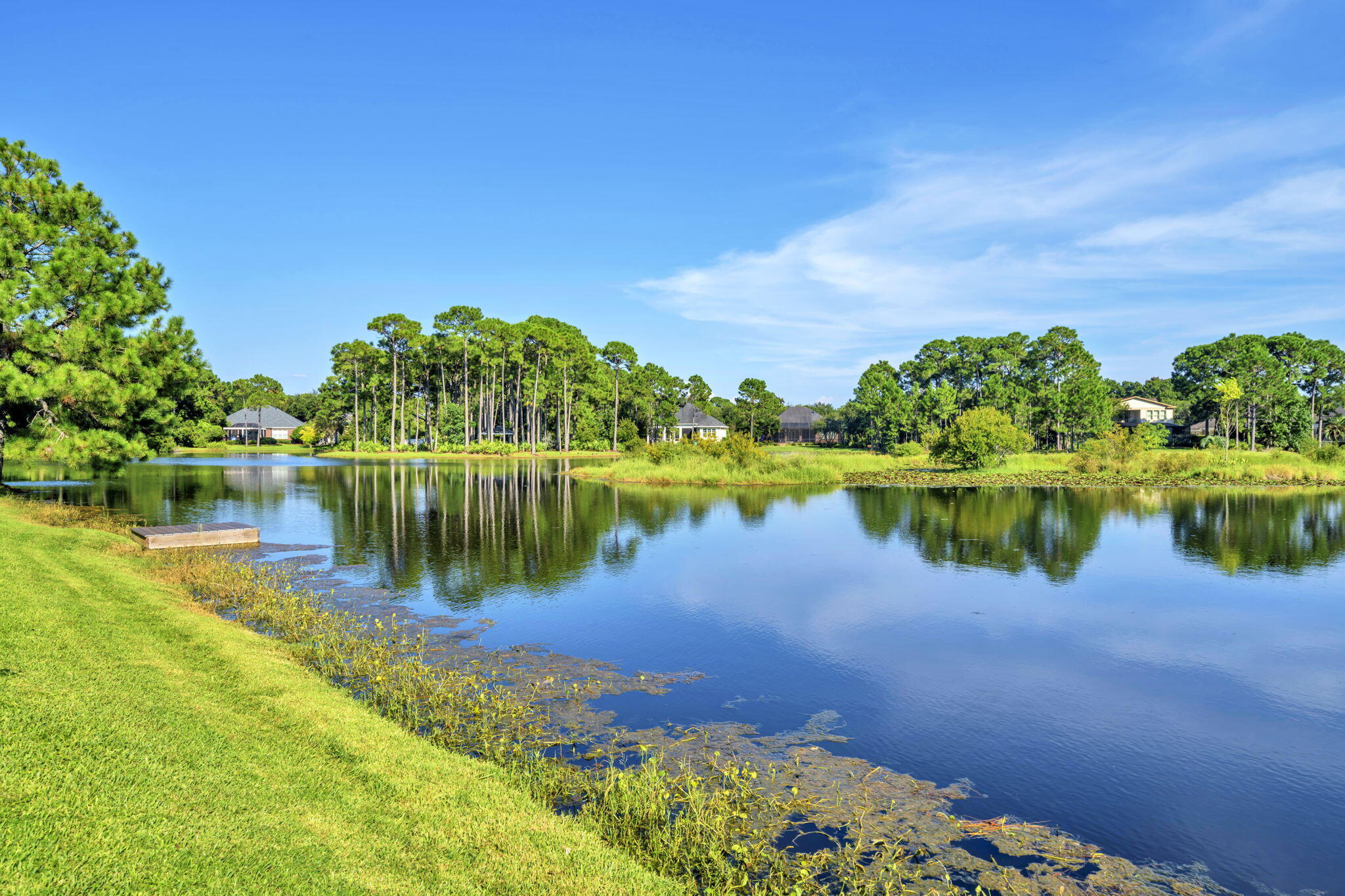 236 Mattie's Way Destin, FL 32541 - Photo 79 of 156 a view of a lake with a house in the background