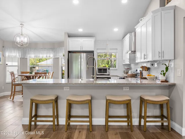 a kitchen with counter space cabinets and appliances