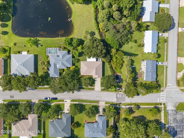an aerial view of a house with a garden