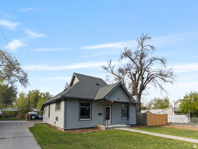 158 East 300 South Logan, UT 84321 - Photo 3 of 25 Bungalow-style house with a shingled roof and covered porch