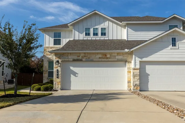 a front view of a house with a garage