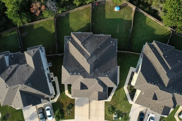 an aerial view of a house with outdoor space